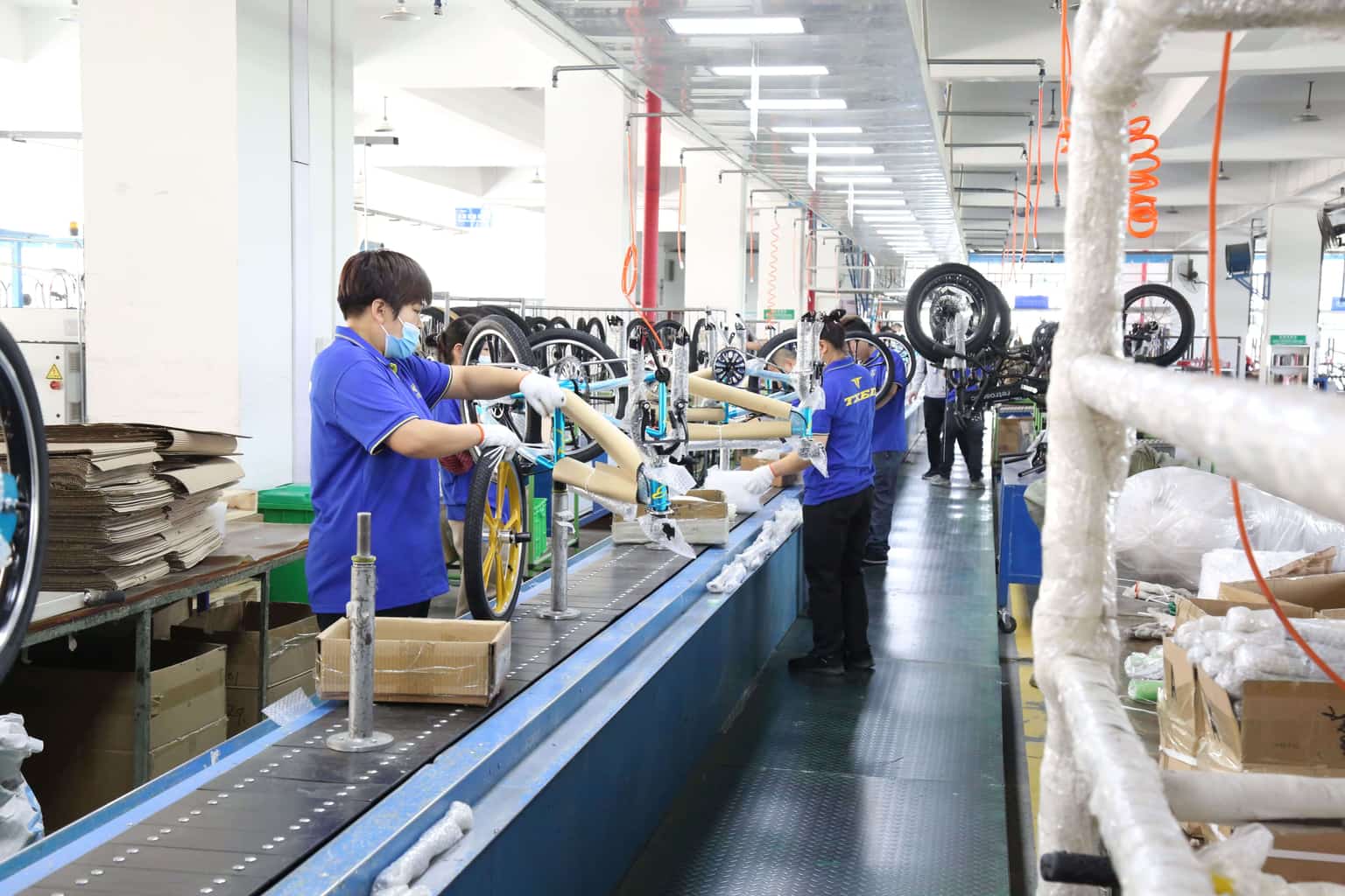 Technician performing quality control checks on a finished e-bike