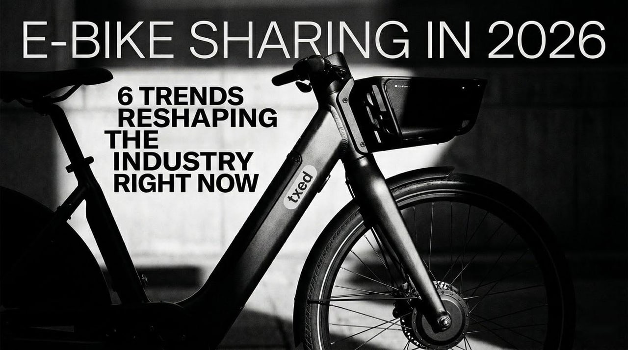 Row of shared e-bikes docked at a smart charging station in a modern city
